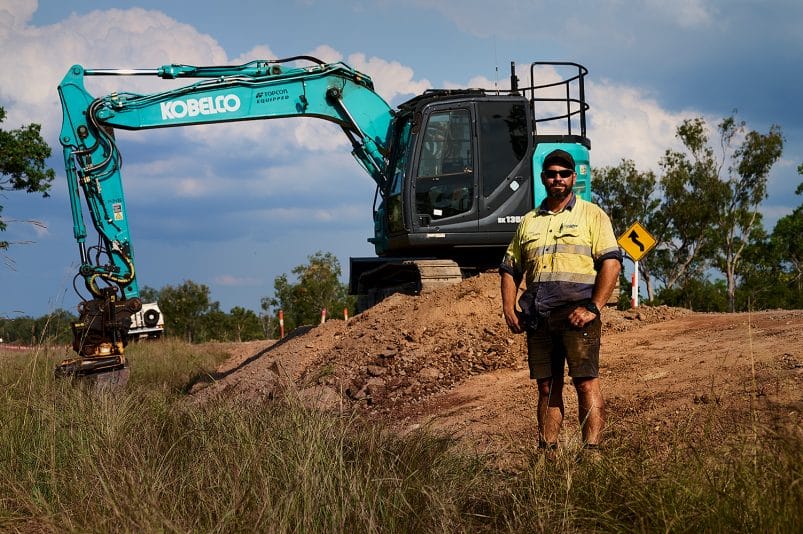 Kobelco Customer In Front Of Machine