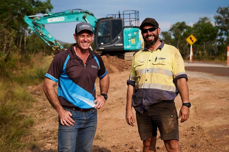 Kobelco Customer In Front Of Machine